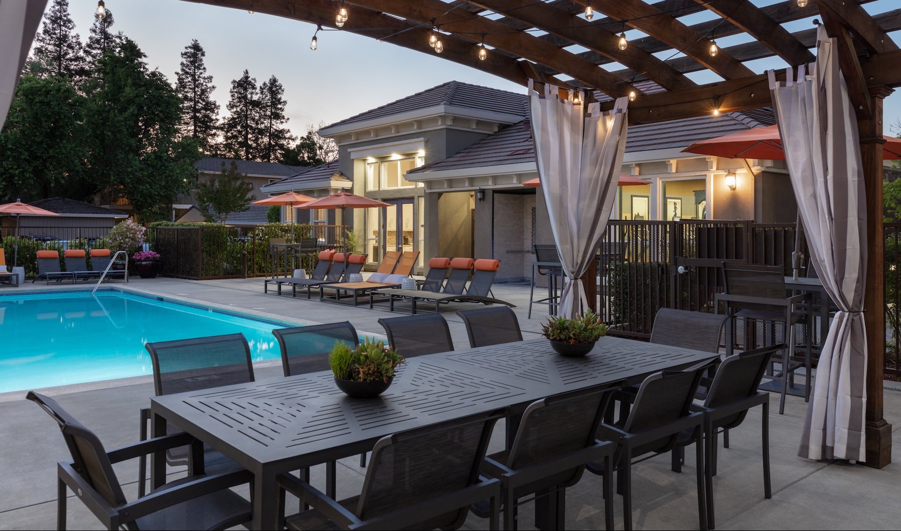 a pool with a table and chairs