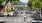 a street with cars and people