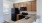 a kitchen with wooden cabinets