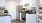 a kitchen with white cabinets