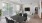 a living room with a tv and couches