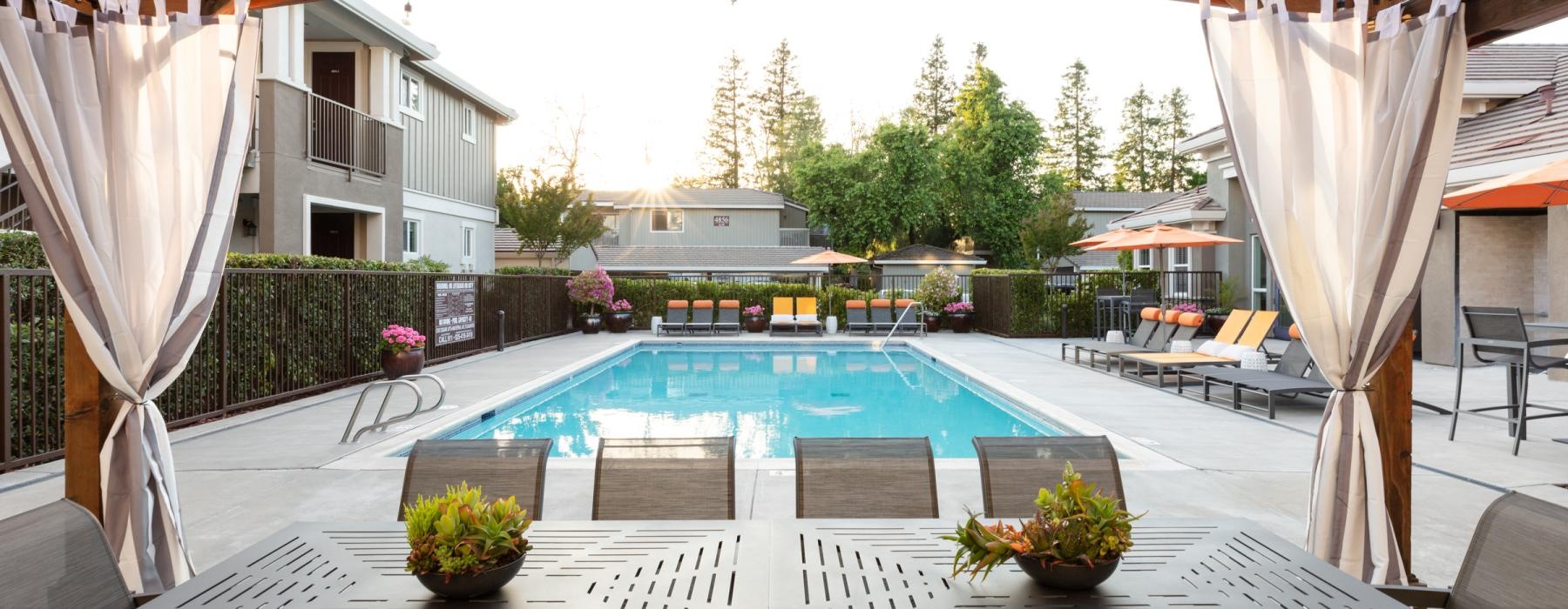a swimming pool with a covered patio