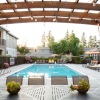 a swimming pool with a covered patio