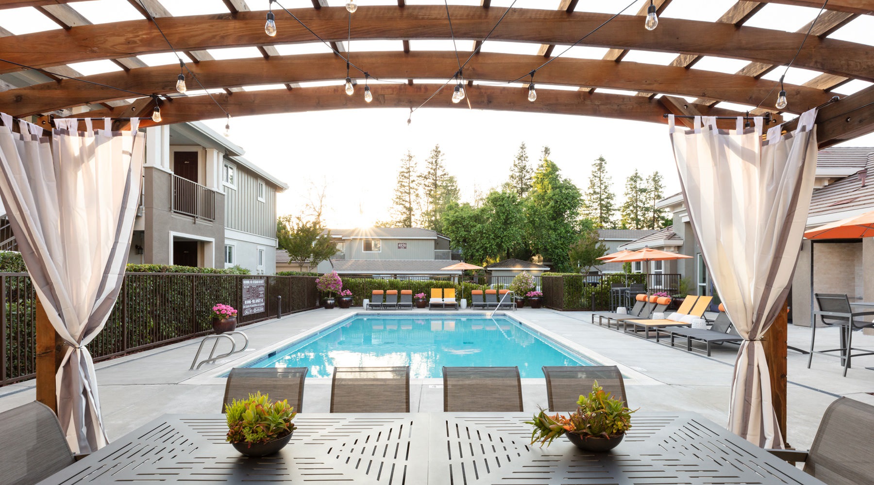 a swimming pool with a covered patio