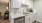 a kitchen with white cabinets