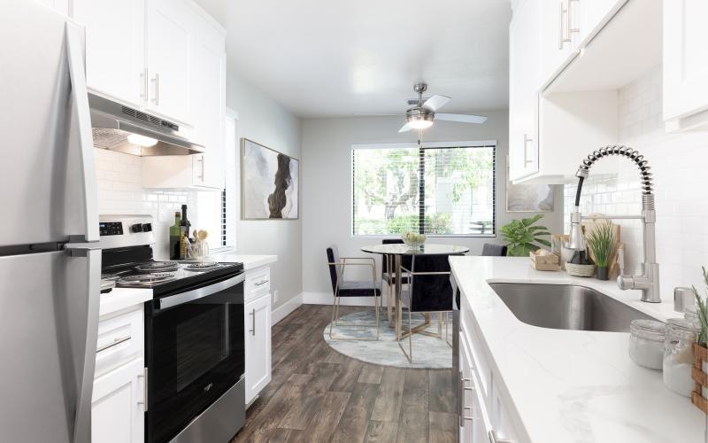 a kitchen with white cabinets