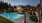 a swimming pool with a covered patio