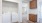 a kitchen with white cabinets